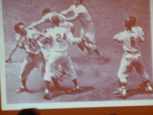 Logan (left) is ready to deliver a haymaker to Dodger manager Walter Alston (24).
